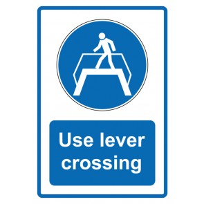 Schild Gebotzeichen Piktogramm & Text englisch · Use lever crossing · blau